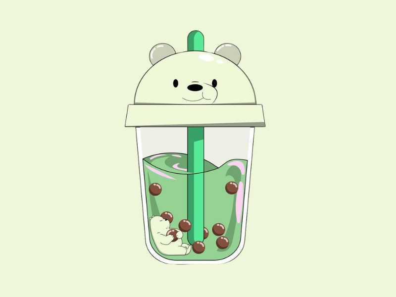 Hình ảnh ly trà sữa xanh matcha với topping trân châu trắng và kem sữa tươi xốp